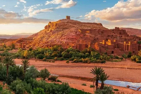 15 Days Morocco Tour From Casablanca/Travelers riding camels across the golden dunes of the Sahara Desert during a 15 Days Morocco Tour from Casablanca