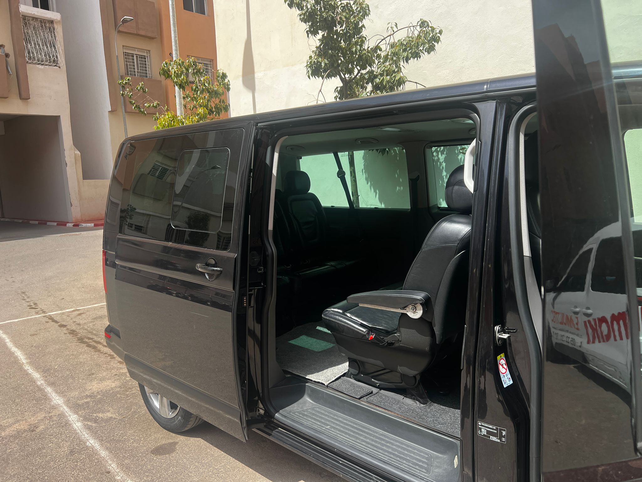 Hire A Car With Guide In Morocco.Professional chauffeur guiding tourists in a comfortable rental car through Morocco’s scenic routes.Luxury SUV with a private driver for hire in Morocco, ready for desert and city tours.raveler enjoying a guided road trip in Morocco with a rented car and expert local guide.