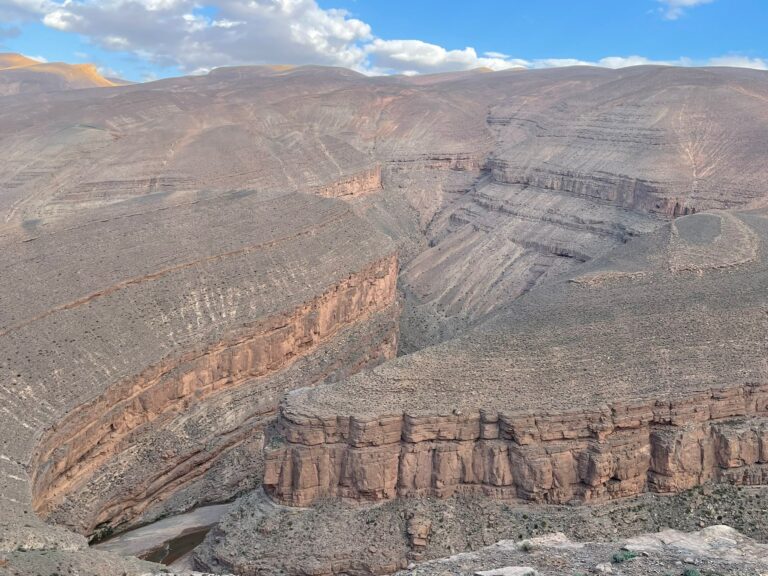 5 Day Desert Tour From MarrakechCamel caravan crossing the golden Erg Chebbi dunes at sunset in Merzouga, Morocco Traditional Berber desert camp under starry skies in the Sahara Desert Scenic view of the High Atlas Mountains on the way from Marrakech to the desert UNESCO World Heritage Ait Benhaddou Kasbah near Ouarzazate, Morocco Tourists enjoying a camel trekking experience in the Moroccan Sahara