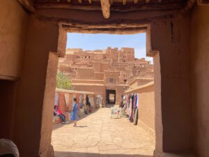 8 Day Desert Tour From Casablanca.A group of tourists riding camels in a single-file line across the orange sand dunes of the Sahara Desert near Merzouga, Morocco, under a clear blue sky.A knowledgeable guide explains the significance of landmarks, architecture, and streets.Access to narrow alleyways (medina lanes), hidden courtyards, and local spots that vehicles can't reach.,Walking through bustling souks (markets), past food stalls, and through public squares offers an authentic slice of daily life. The slow pace allows for photography, questions, and stopping to appreciate details you would otherwise miss. A narrow, cobblestone alleyway winding through the ancient medina with traditional Moroccan architecture.,A vibrant and crowded souk in Marrakech with stalls selling piles of colorful spices and traditional lanterns.,A diverse group of tourists on a walking tour listening to their guide explain the history of a building.,Close-up of detailed blue and white geometric mosaic tilework (zellij) on a historical Moroccan wall., Panoramic view from a rooftop overlooking the city of Fes, showcasing the sprawling medina and modern districts.,A visitor observes a skilled local artisan hand-weaving a traditional Berber carpet on a wooden loom.