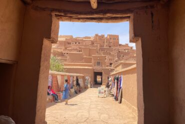 8 Day Desert Tour From Casablanca.A group of tourists riding camels in a single-file line across the orange sand dunes of the Sahara Desert near Merzouga, Morocco, under a clear blue sky.A knowledgeable guide explains the significance of landmarks, architecture, and streets.Access to narrow alleyways (medina lanes), hidden courtyards, and local spots that vehicles can't reach.,Walking through bustling souks (markets), past food stalls, and through public squares offers an authentic slice of daily life. The slow pace allows for photography, questions, and stopping to appreciate details you would otherwise miss. A narrow, cobblestone alleyway winding through the ancient medina with traditional Moroccan architecture.,A vibrant and crowded souk in Marrakech with stalls selling piles of colorful spices and traditional lanterns.,A diverse group of tourists on a walking tour listening to their guide explain the history of a building.,Close-up of detailed blue and white geometric mosaic tilework (zellij) on a historical Moroccan wall., Panoramic view from a rooftop overlooking the city of Fes, showcasing the sprawling medina and modern districts.,A visitor observes a skilled local artisan hand-weaving a traditional Berber carpet on a wooden loom.