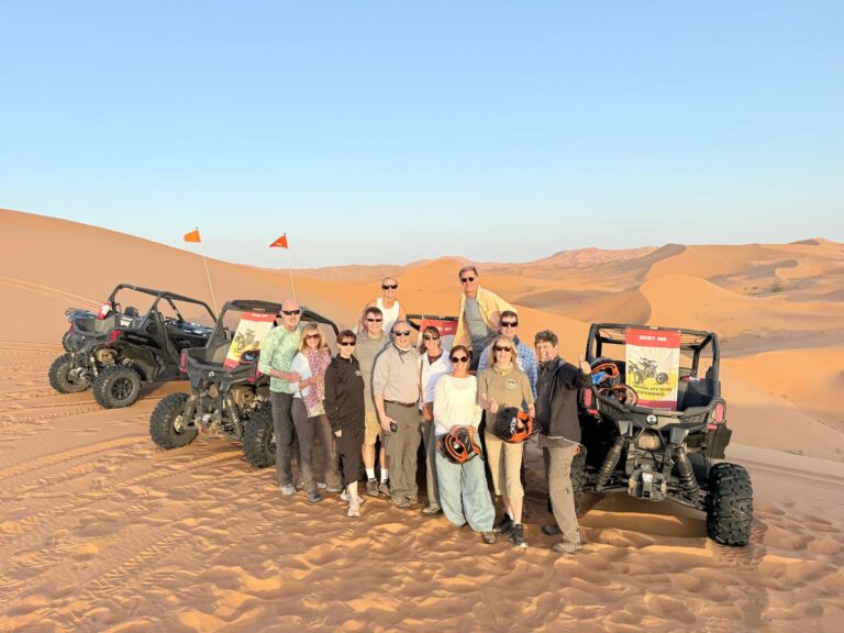 9 day desert tour from marrakech .Traveler riding a camel across the vast Erg Chebbi dunes with a sunset sky, part of a Morocco desert adventure." "Scenic view of Morocco’s desert landscapes, including sand dunes, rocky valleys, and traditional desert camp tents." "Overnight desert camp in Erg Chebbi with camels and starry night sky during a multi-day Morocco tour." "Historic city streets and colorful architecture in Fes and Chefchaouen, featured on a cultural Morocco tour." "Panoramic view of Todra Gorge cliffs and winding river on a scenic Morocco desert and city tour."