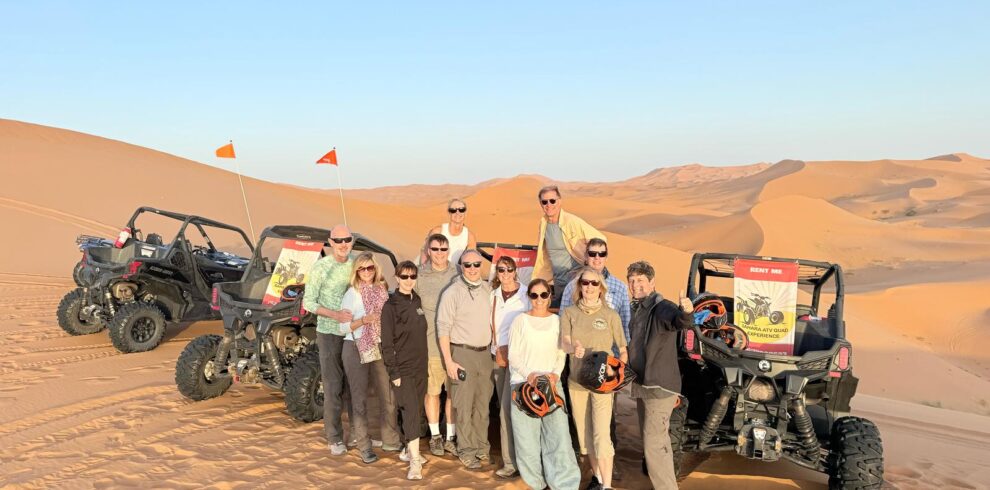 9 day desert tour from marrakech .Traveler riding a camel across the vast Erg Chebbi dunes with a sunset sky, part of a Morocco desert adventure." "Scenic view of Morocco’s desert landscapes, including sand dunes, rocky valleys, and traditional desert camp tents." "Overnight desert camp in Erg Chebbi with camels and starry night sky during a multi-day Morocco tour." "Historic city streets and colorful architecture in Fes and Chefchaouen, featured on a cultural Morocco tour." "Panoramic view of Todra Gorge cliffs and winding river on a scenic Morocco desert and city tour."