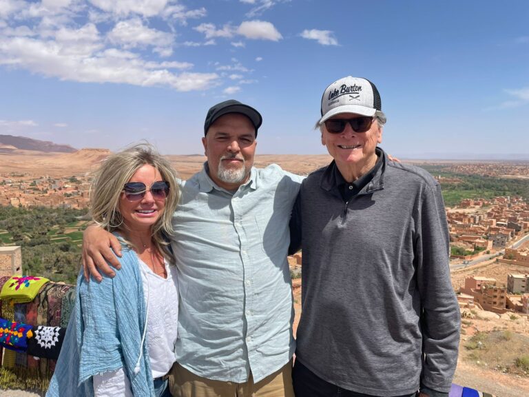 18-day desert tour from Casablanca/Travelers riding camels across the golden dunes of Merzouga during an 18-day Morocco desert tour from Casablanca, with scenic views of the Sahara at sunset.