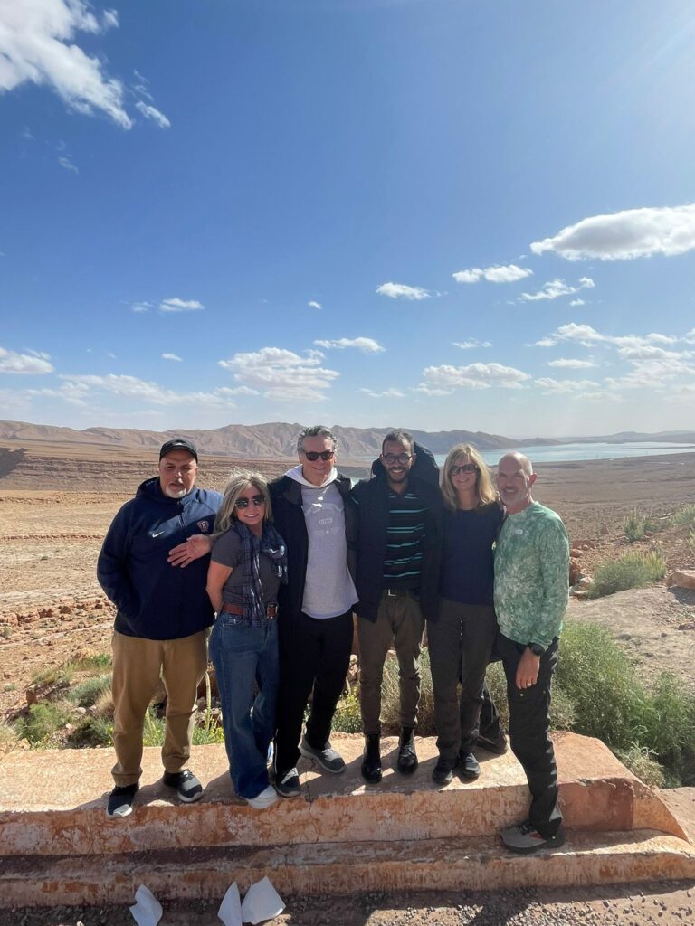Nine Days Morocco Tour Itinerary,Camel caravan crossing the Sahara Desert at sunset during a nine-day Morocco tour" "Panoramic view of Chefchaouen, the Blue City, featured in a 9-day Morocco itinerary" "Traditional Moroccan riad courtyard included in a nine-day Morocco travel experience" "Tourists exploring the ancient medina of Fes on a guided nine-day Morocco itinerary" "Luxury desert camp under the stars in Merzouga on a nine-day Morocco tour Aerial view of Marrakech’s Jemaa el-Fnaa square bustling with activity during a 9-day Morocco tour" "Colorful Moroccan spices on display in a souk visited during a nine-day itinerary in Morocco" "Tourists enjoying a scenic drive through the Atlas Mountains on day four of a Morocco tour" "Sunrise over the Sahara Desert with camels and Berber guides on a 9-day Morocco itinerary" "Local guide showing historical ruins in Ait Benhaddou, a UNESCO site on a Morocco tour" "Travelers taking photos in the narrow blue streets of Chefchaouen on a nine-day Moroccan journey" "Traditional Moroccan tagine being served during a culinary stop on a 9-day Morocco tour" "Interior of Hassan II Mosque in Casablanca, the starting point of a nine-day Morocco trip" "Couple watching the sunset from a desert camp in Erg Chebbi during a Morocco tour itinerary" "Scenic palm oasis in the Draa Valley visited on a nine-day Morocco tour adventure"